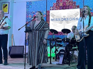 4-piece band MirrorSong on stage, drums, 2 guitars and a singer - 2 men and 2 women