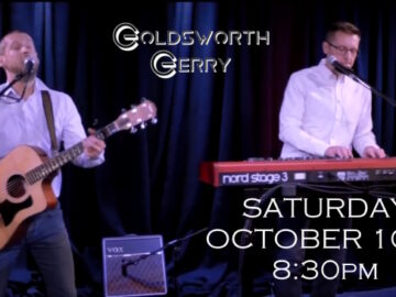 Duo on stage with date and time of next gig at club - Saturday October 10th at 8:30pm