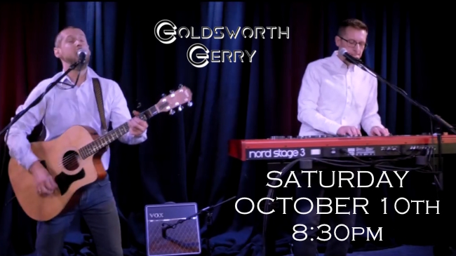 Duo on stage with date and time of next gig at club - Saturday October 10th at 8:30pm